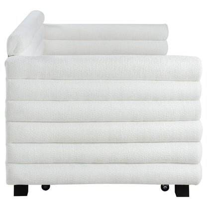 Fandango white towels stacked on a bed with black legs and wheels on Tampa Home & Garden Store