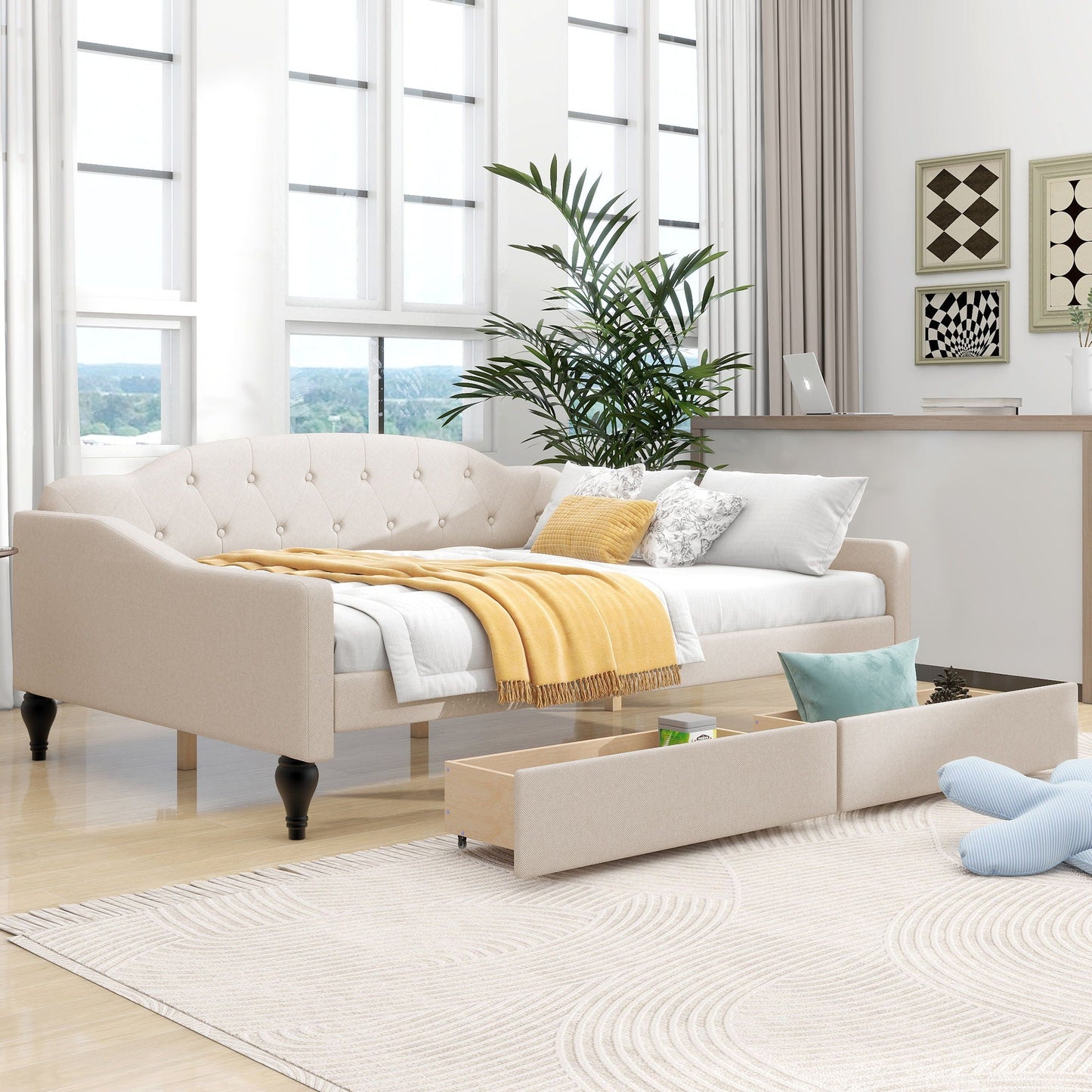 Beige upholstered tufted daybed with yellow throw in a bright living room on Tampa Home & Garden Store