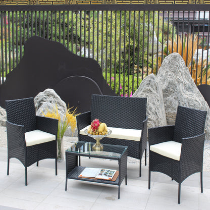4 pc black rattan outdoor seating set with cushioned chairs and glass table on Tampa Home & Garden Store