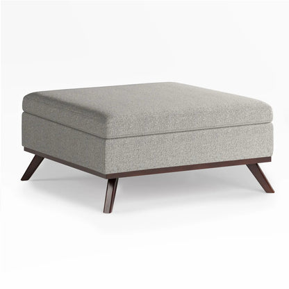 Owen multifunctional square storage ottoman in gray fabric and dark wood legs on Tampa Home & Garden Store