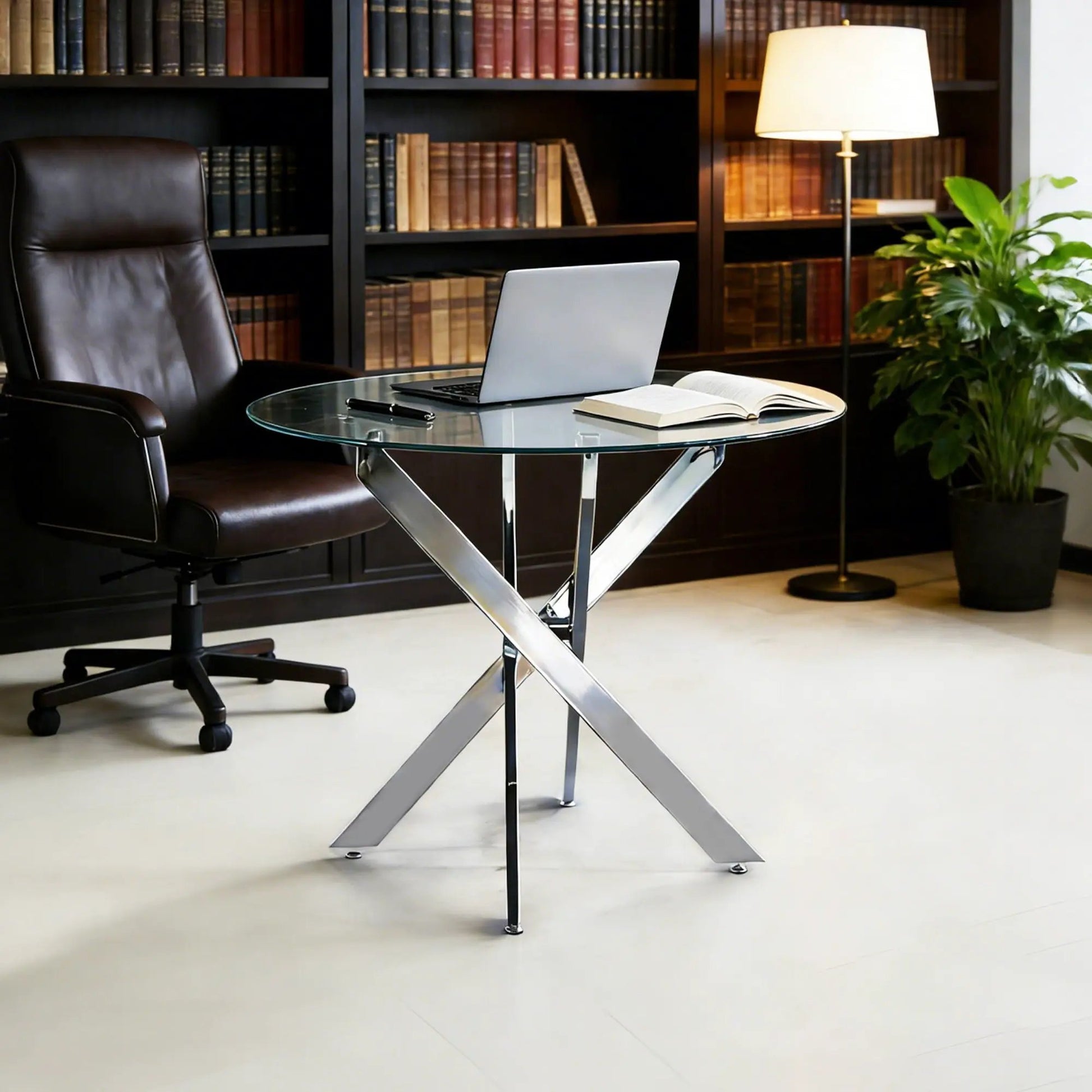 Dining table with round tempered glass top and cross metal legs in a modern space-saving design on Tampa Home & Garden Store