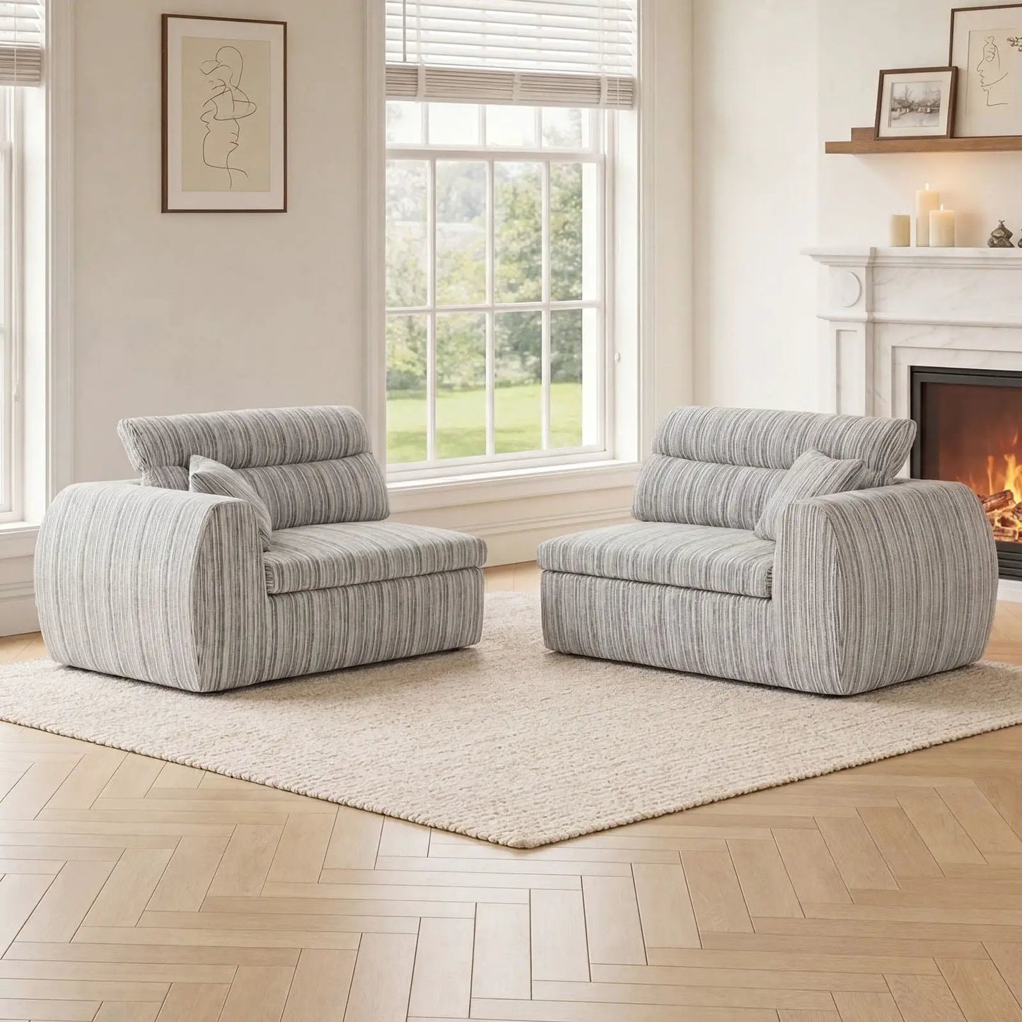 Two gray striped stationary sofas with bolster pillows in a bright living room by a fireplace on Tampa Home & Garden Store