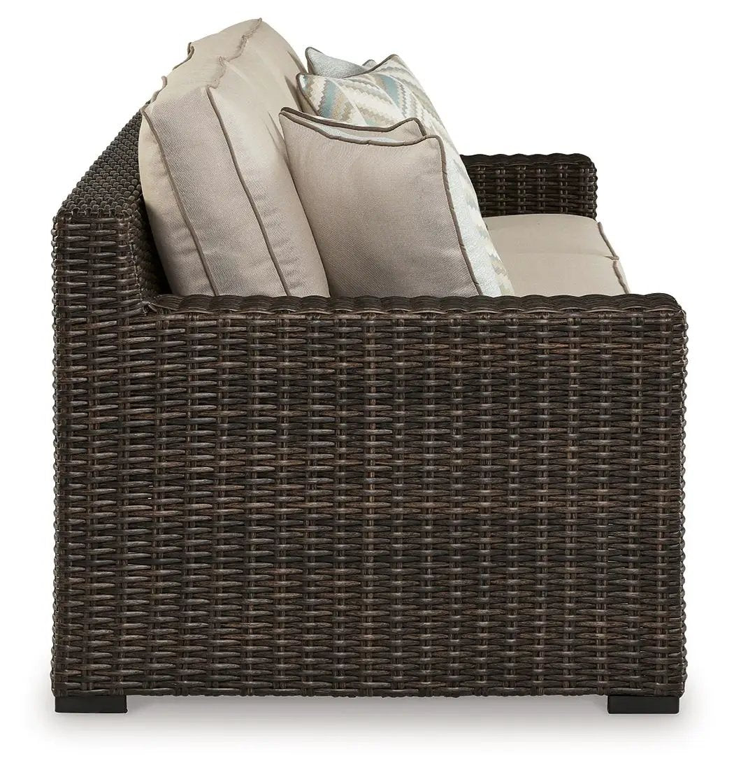 Coastline Bay sofa in brown wicker with beige cushions by Unique Piece Furniture on Tampa Home & Garden Store