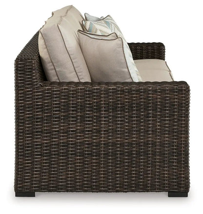 Coastline Bay sofa in brown wicker with beige cushions by Unique Piece Furniture on Tampa Home & Garden Store