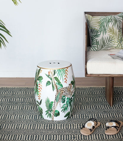 Jungle-themed ceramic garden stool with palm leaves and leopard accents, white with gold rim on Tampa Home & Garden Store