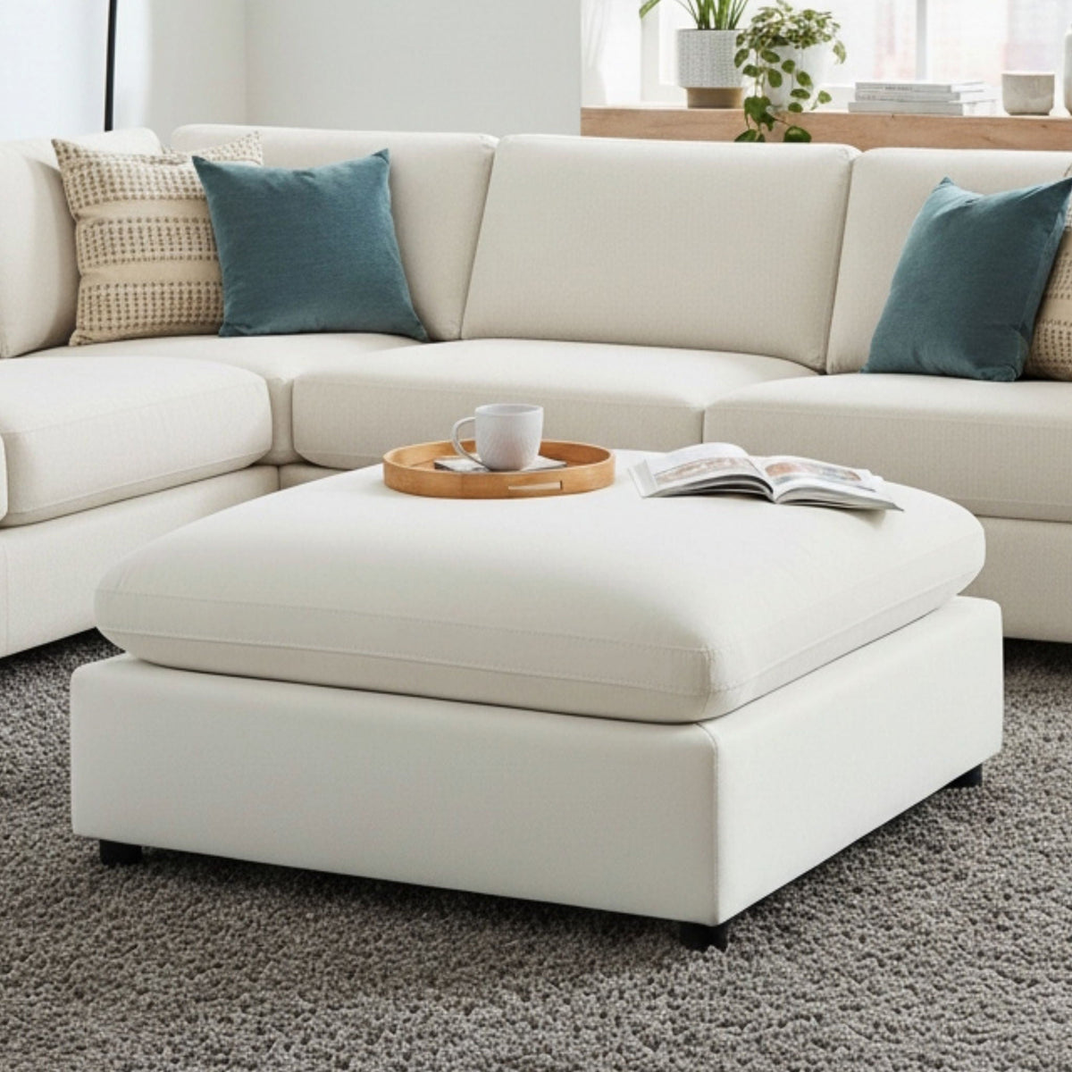 Caylie upholstered ottoman with removable covers in beige for living room use on Tampa Home & Garden Store