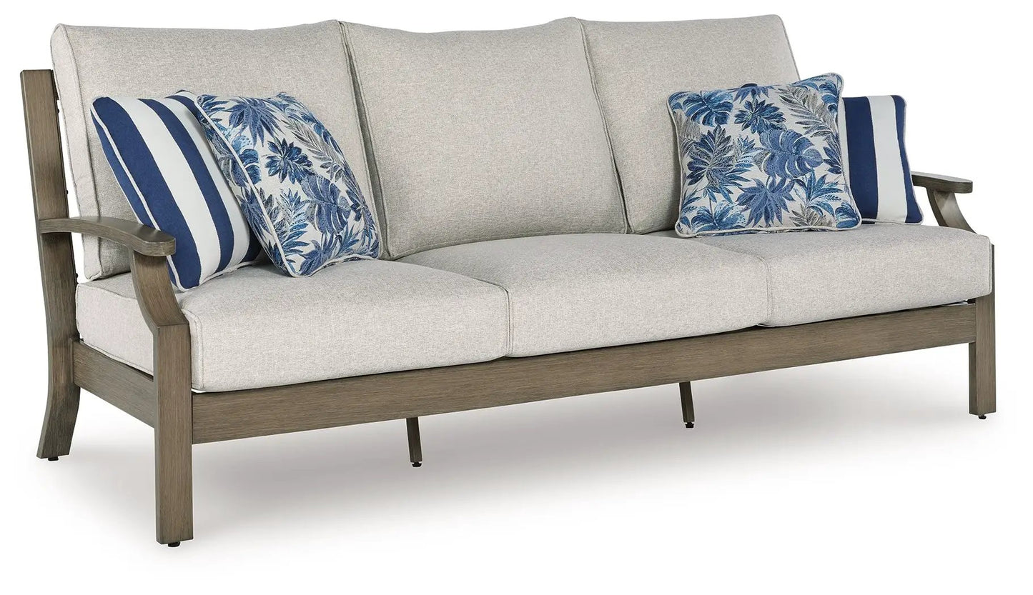 Rainier Ranch sofa beige fabric cushions and wood frame with blue pillows on Tampa Home & Garden Store