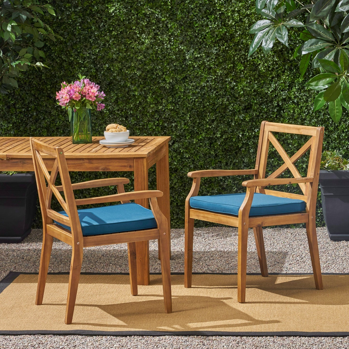 Perla Outdoor Dining Chairs, 2pc set with blue cushions and wooden frames on patio on Tampa Home & Garden Store