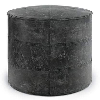 Handcrafted round leather accent pouf in distressed black with topstitched seams on Tampa Home & Garden Store
