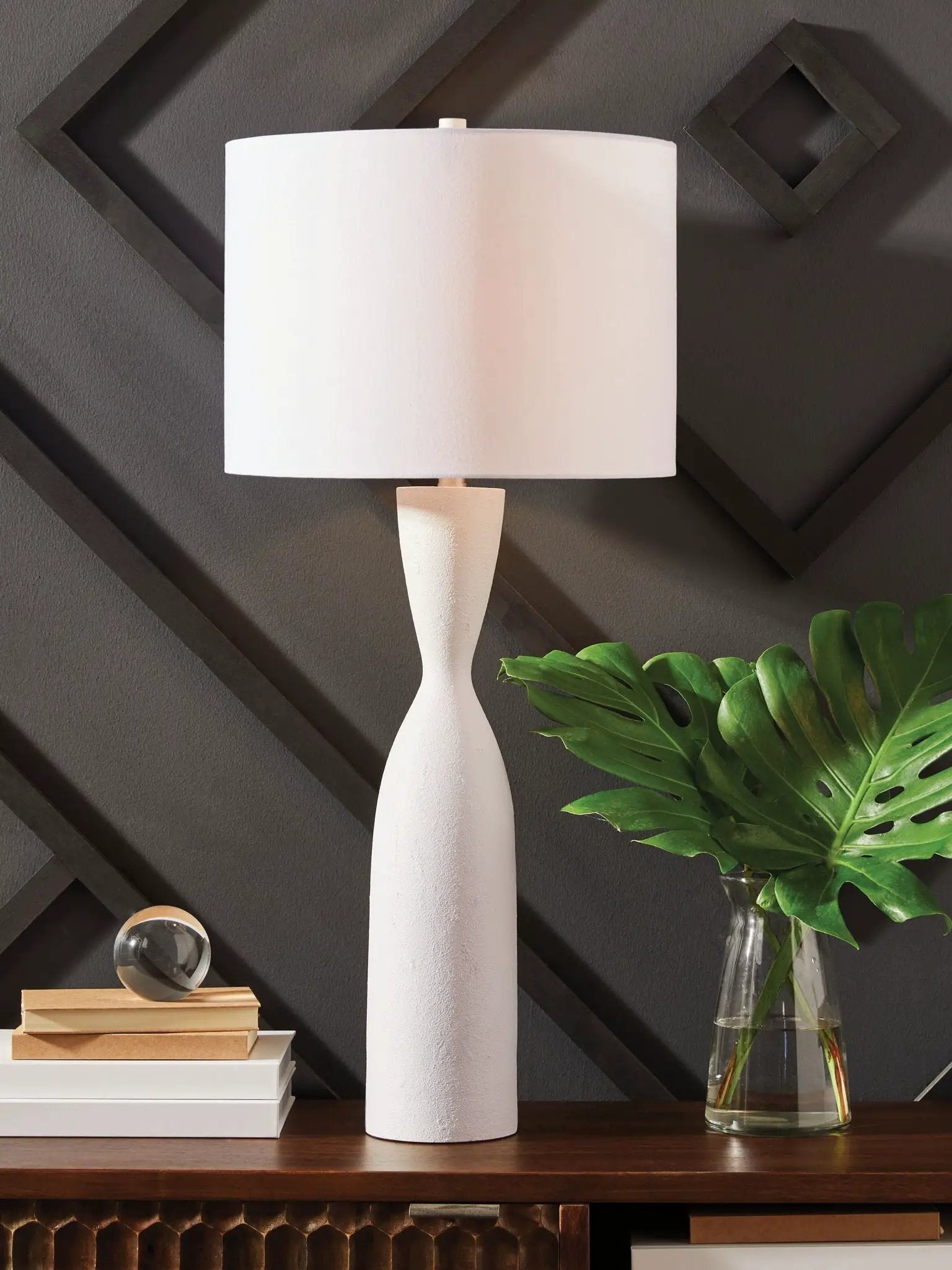 Davinford Poly Table Lamp white base with tapered body and white shade on dark wall on Tampa Home & Garden Store