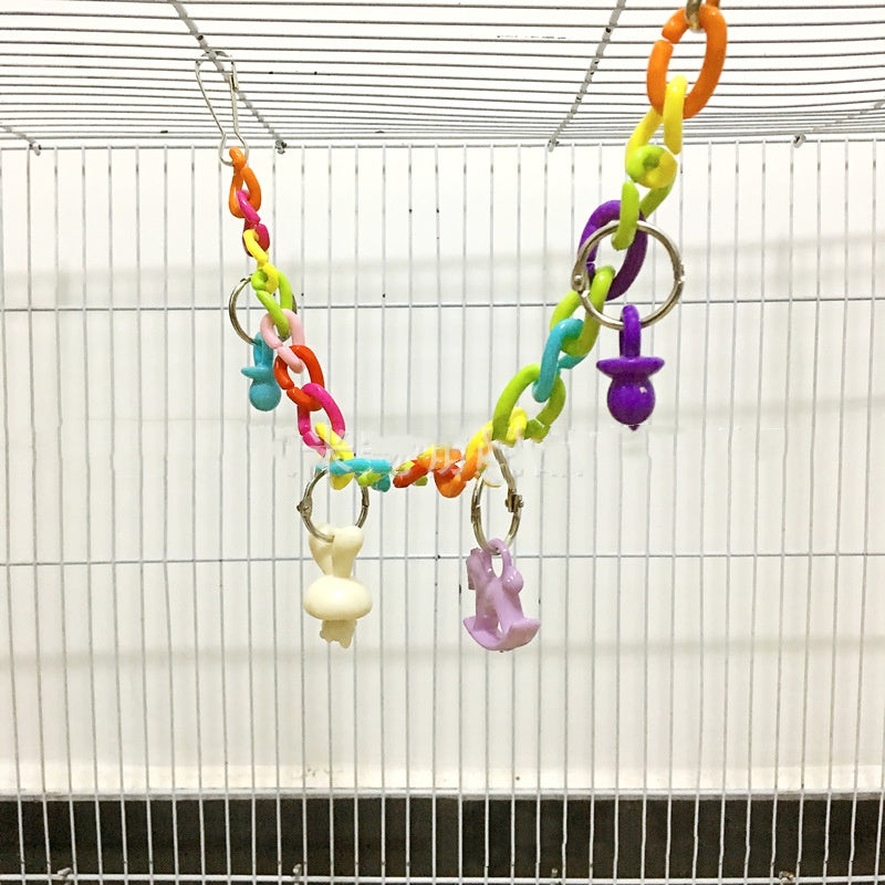 Parrot acrylic chain suspension bridge swing toy with colorful links inside a bird cage on Tampa Home & Garden Store