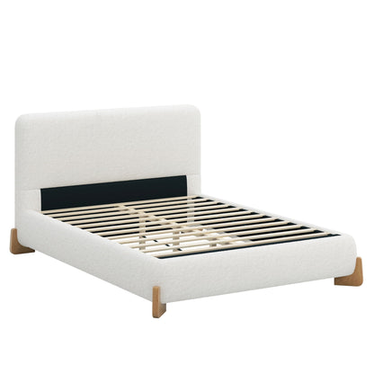 Boucle upholstered bed with solid wood feet, cream fabric, black headboard panel, slatted base on Tampa Home & Garden Store