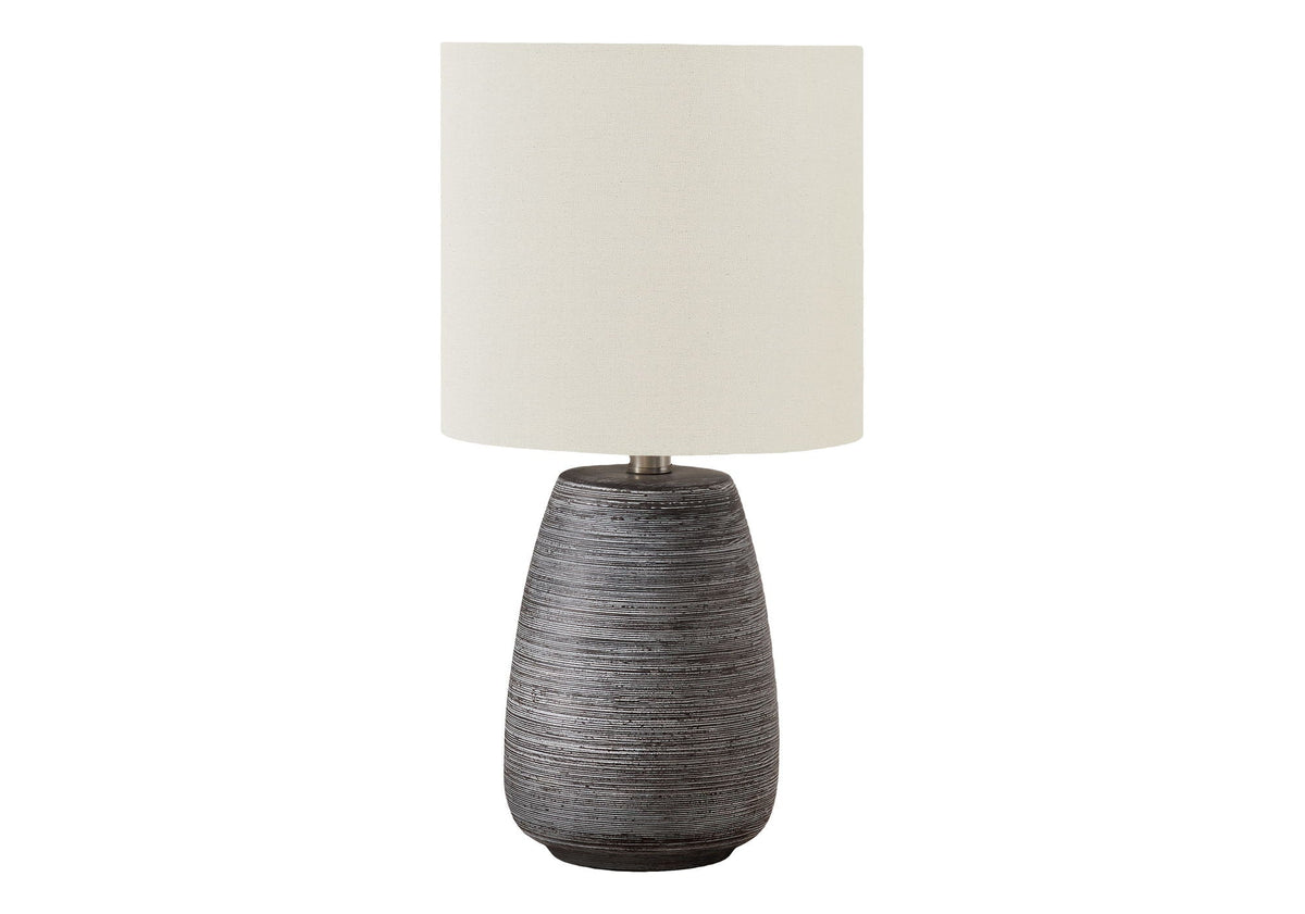 Contemporary ceramic table lamp with a textured gray base and cream shade by HouseOfZazla on Tampa Home & Garden Store
