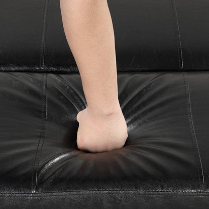 Twin folding sleeper ottoman surface in black faux leather with visible stitching; leg resting on Tampa Home & Garden Store