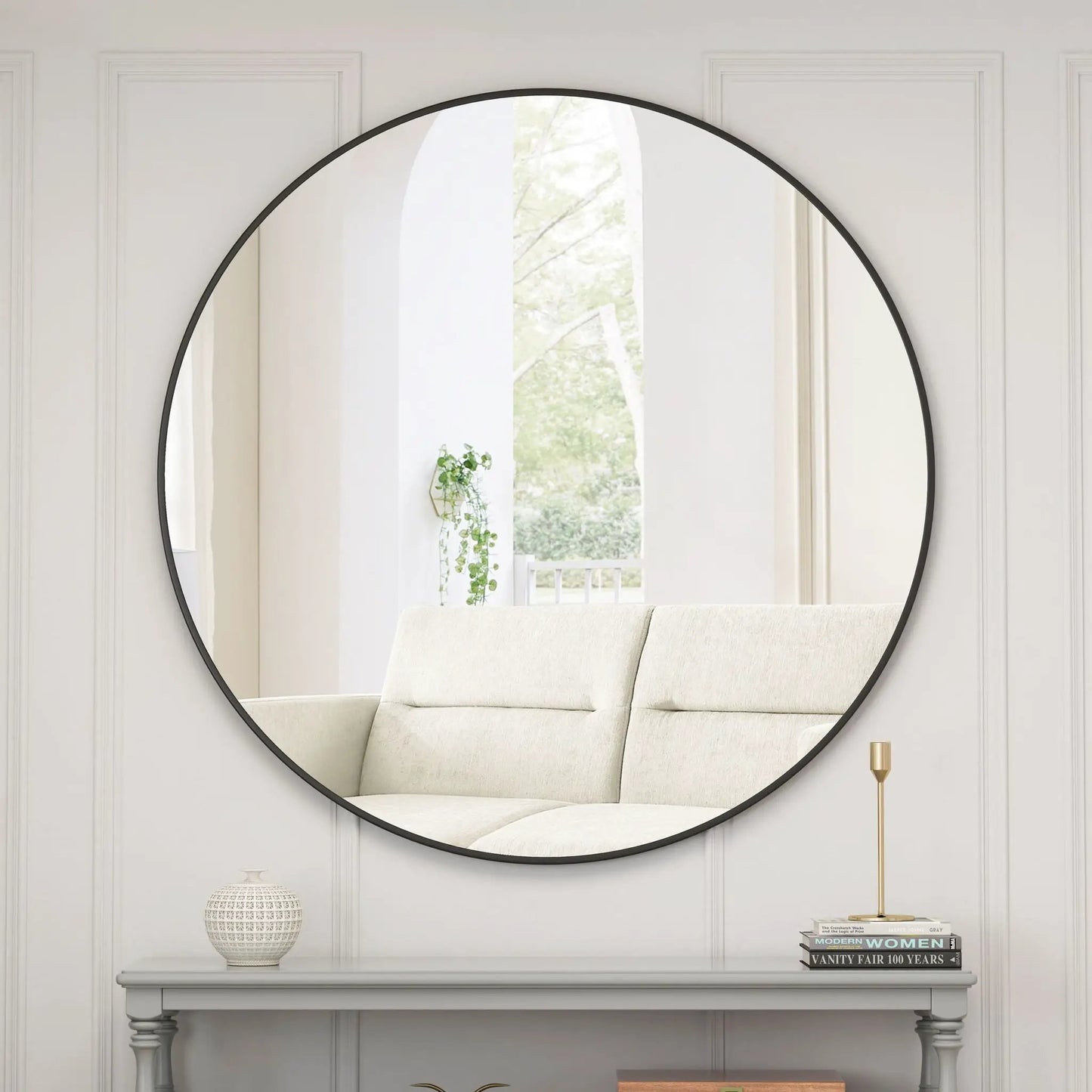 Round wall mirror with black metal frame by Unique Piece Furniture for living room decor on Tampa Home & Garden Store