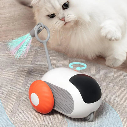 Remote control cat toy car with white body, orange wheels, gray side panel, feather wand on Tampa Home & Garden Store