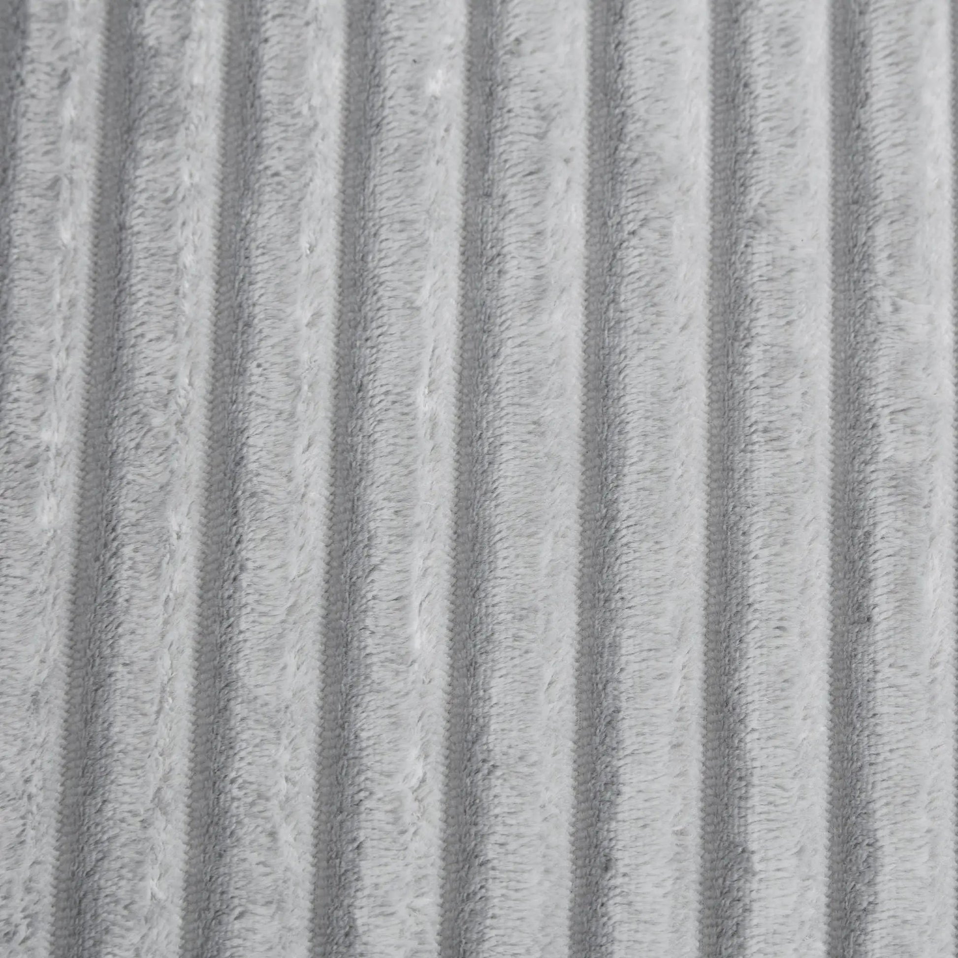 Chaise upholstery close-up in grey plush fabric with vertical ridges on Tampa Home & Garden Store