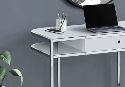 White computer desk with metal frame and drawers; laptop, phone, glass pencil cup on Tampa Home & Garden Store