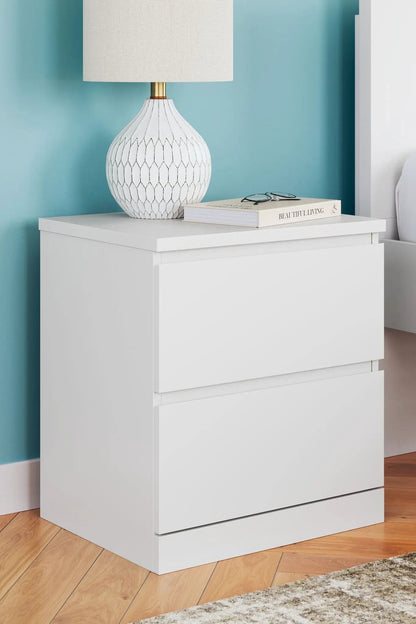 Onita two-drawer night stand in white with a lattice lamp and beige shade, book on top on Tampa Home & Garden Store