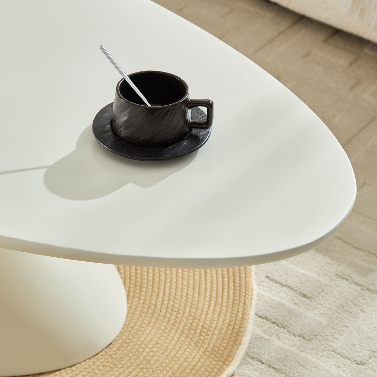 End table from Lucky Stone Shaped Table with Sculptural Base, white top with black mug on Tampa Home & Garden Store