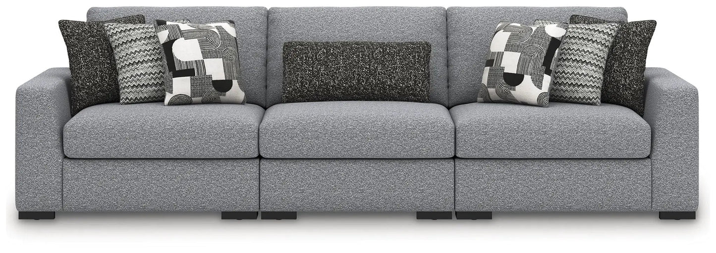 Bealton sectional by Unique Piece Furniture in gray textured fabric with geometric pillows on Tampa Home & Garden Store