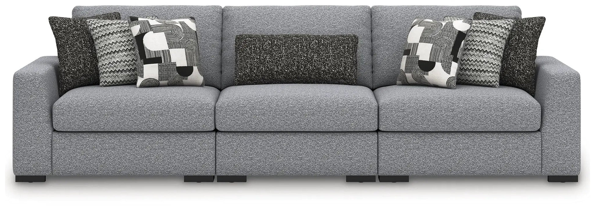 Bealton sectional by Unique Piece Furniture in gray textured fabric with geometric pillows on Tampa Home & Garden Store