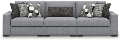 Bealton sectional by Unique Piece Furniture in gray textured fabric with geometric pillows on Tampa Home & Garden Store