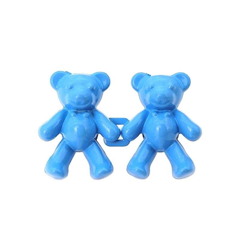 Blue pair of bear shaped plastic clips linked together for jean button extenders Stevvex on Tampa Home & Garden Store