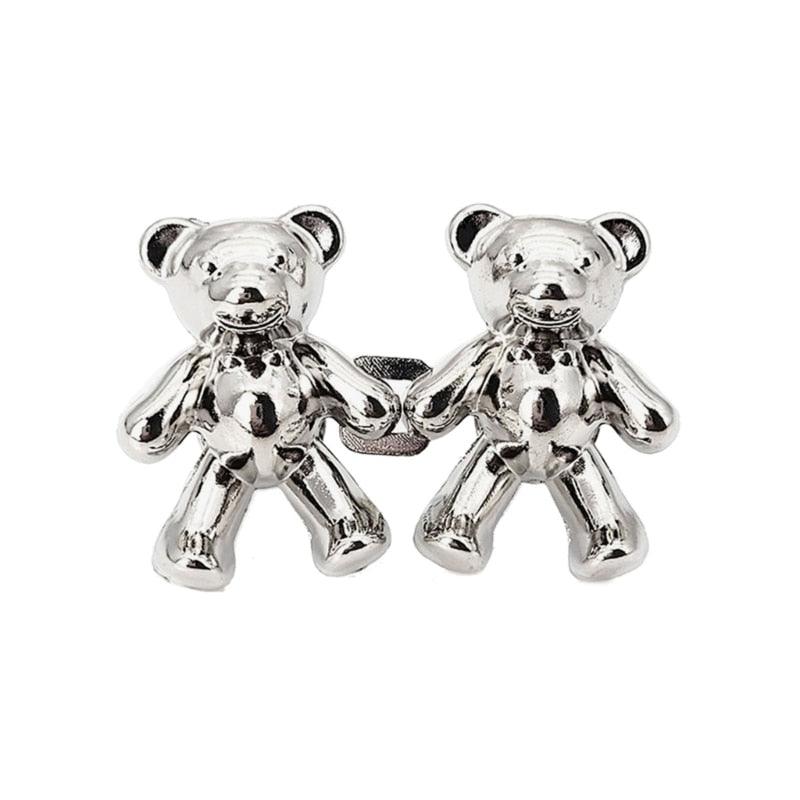 Two silver bear-shaped metal jeans buttons with glossy finish on Tampa Home & Garden Store