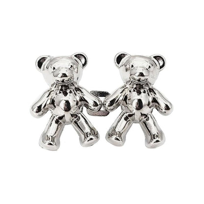Two silver bear-shaped metal jeans buttons with glossy finish on Tampa Home & Garden Store