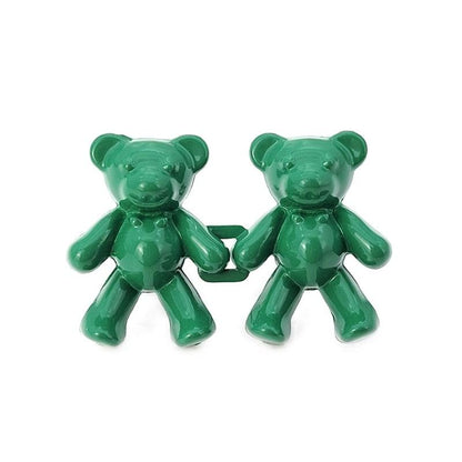 Two green bear-shaped plastic clips connected by a small bar, glossy finish on Tampa Home & Garden Store