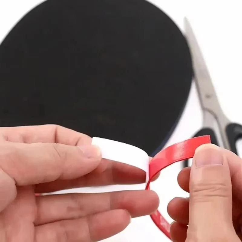 Table Tennis Racket Edge Tape Sponge Protector red edge tape with white backing being peeled on Tampa Home & Garden Store