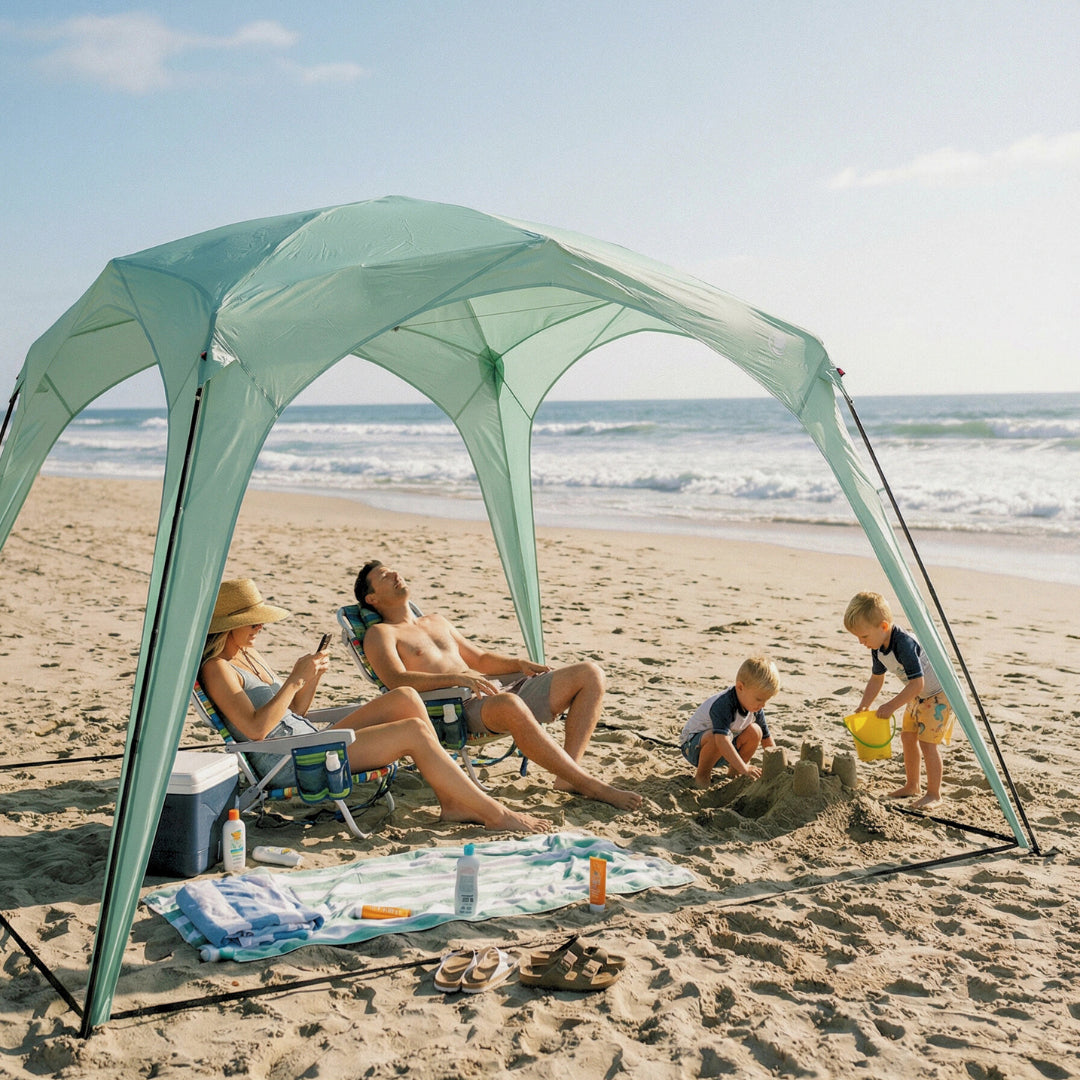 Pop 'N Go canopy by The California Beach Company, mint green beach shelter with family on sand on Tampa Home & Garden Store