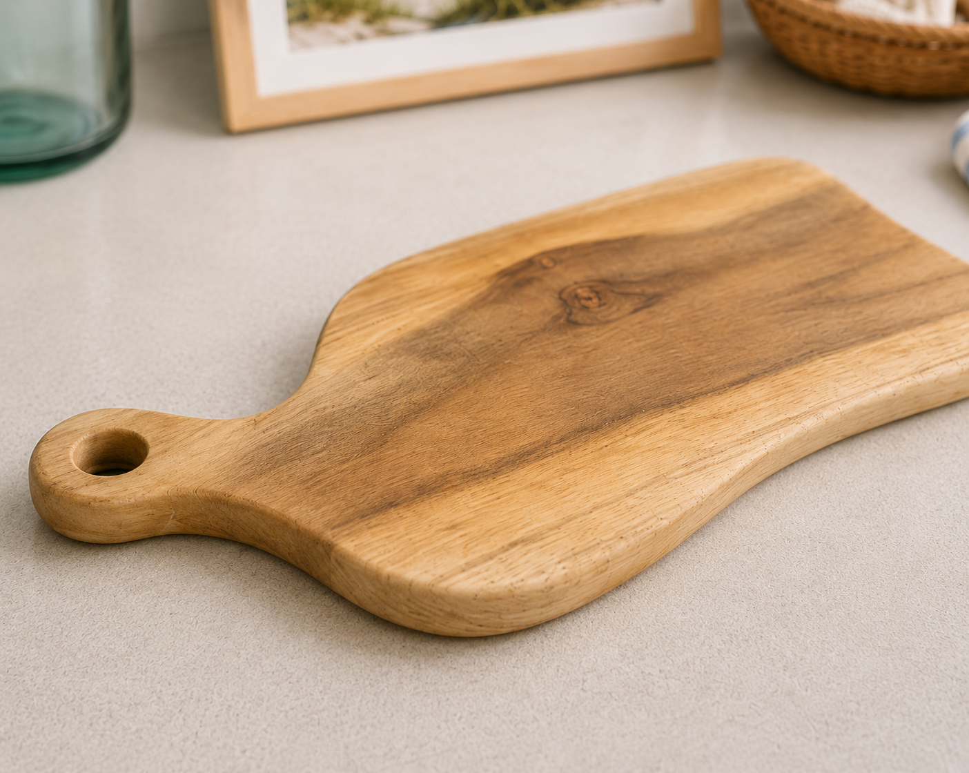 Drift Teak Cutting Board with rounded handle and hanging hole, natural wood grain on Tampa Home & Garden Store