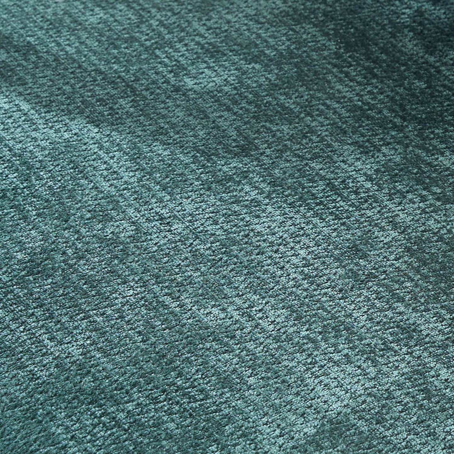 Armchairs teal textured carpet close-up with loop pile fibers for upholstery on Tampa Home & Garden Store