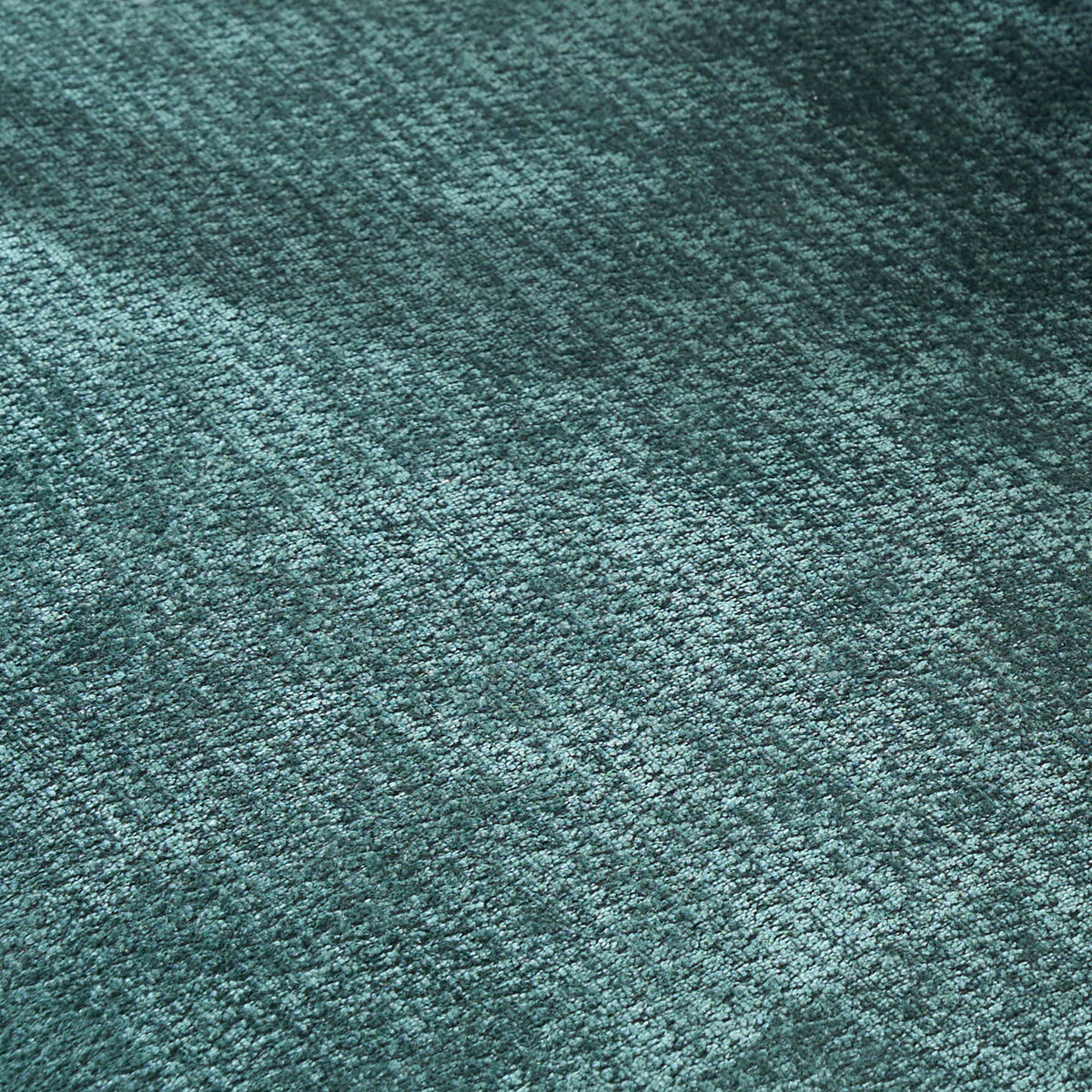 Armchairs teal textured carpet close-up with loop pile fibers for upholstery on Tampa Home & Garden Store