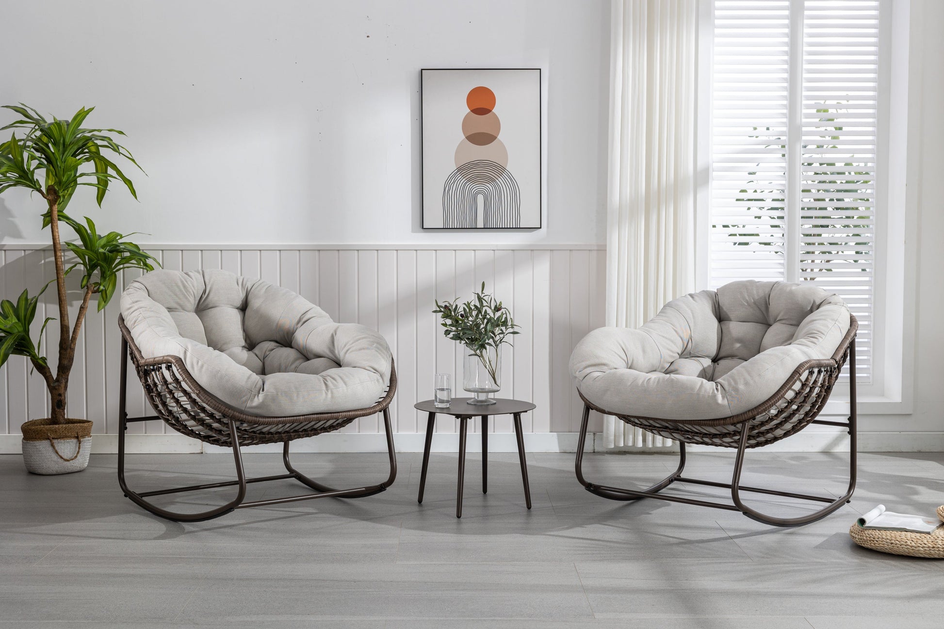 Pair of HouseOfZazla outdoor rattan rocking chairs with beige padded cushions on Tampa Home & Garden Store