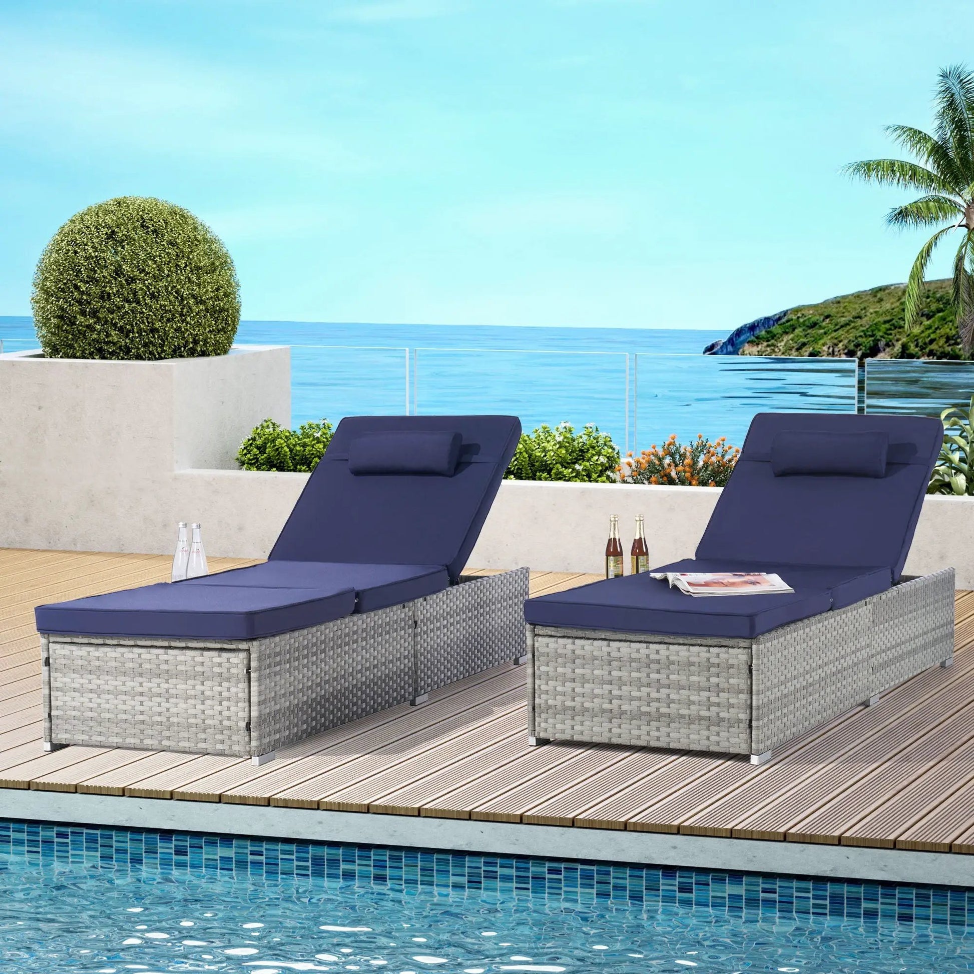 Gray PE rattan outdoor chaise loungers set with navy cushions by Unique Piece Furniture on a pool deck on Tampa Home & Garden Store