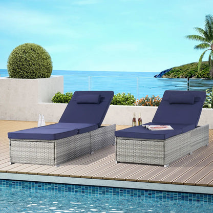 Gray PE rattan outdoor chaise loungers set with navy cushions by Unique Piece Furniture on a pool deck on Tampa Home & Garden Store