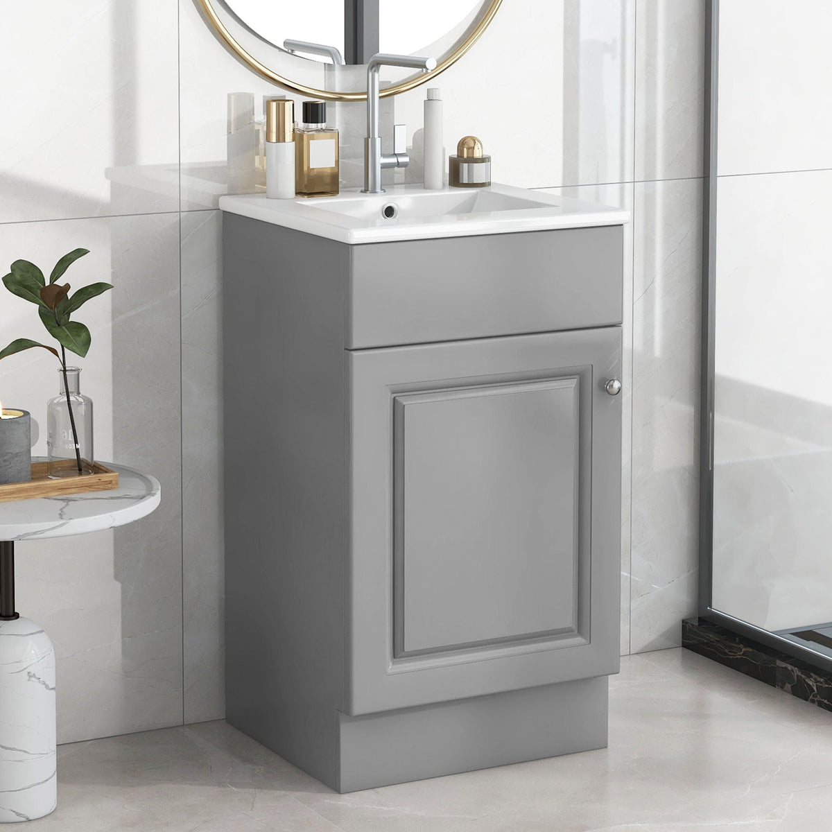 Bathroom vanity with sink, gray cabinet, round gold mirror, 5 bottles on counter on Tampa Home & Garden Store