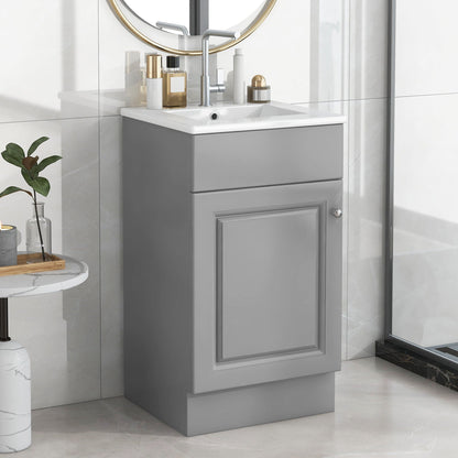 Bathroom vanity with sink, gray cabinet, round gold mirror, 5 bottles on counter on Tampa Home & Garden Store