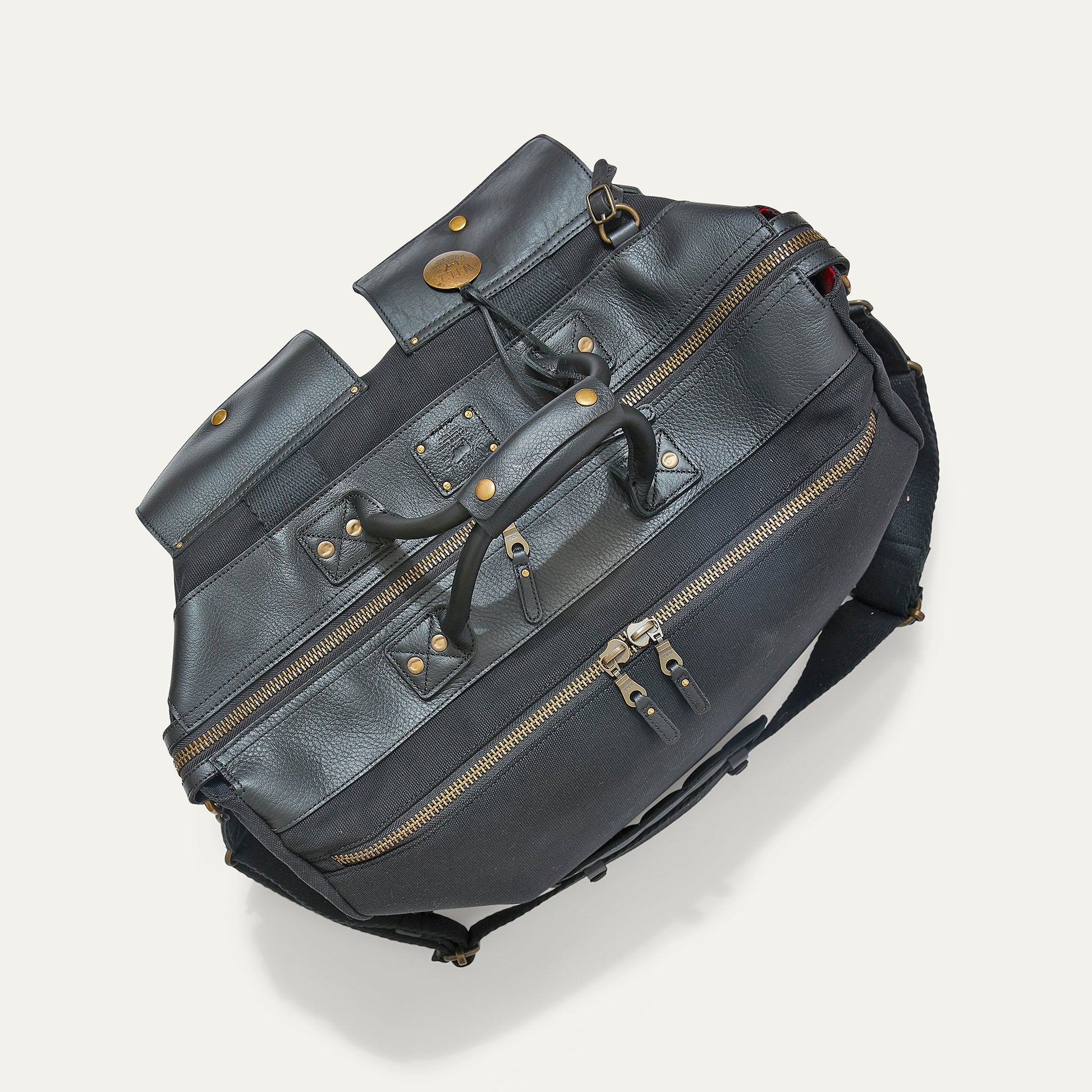 Canvas & Leather Travel Duffle bag by Will Leather Goods in dark navy with brass hardware on Tampa Home & Garden Store