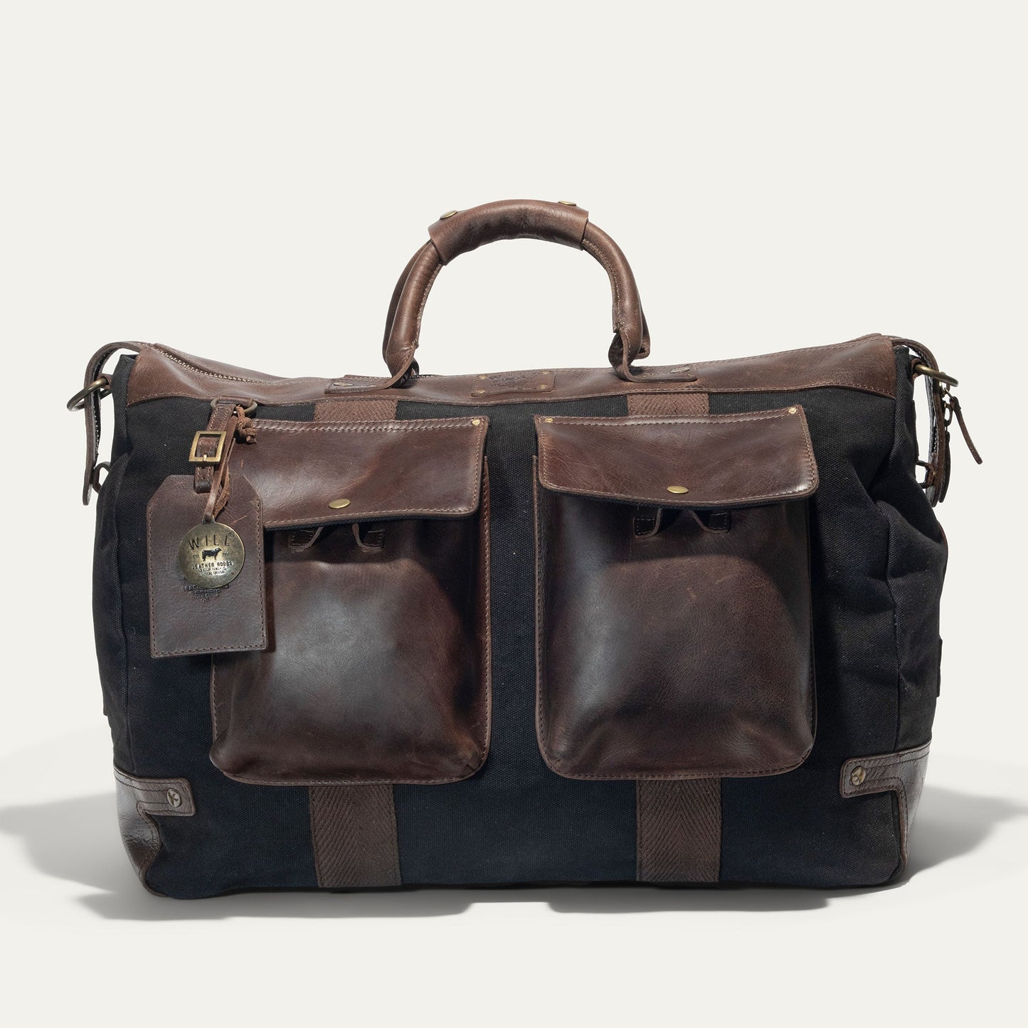 Canvas & Leather Travel Duffle by Will Leather Goods with brown leather trim and front pockets on Tampa Home & Garden Store