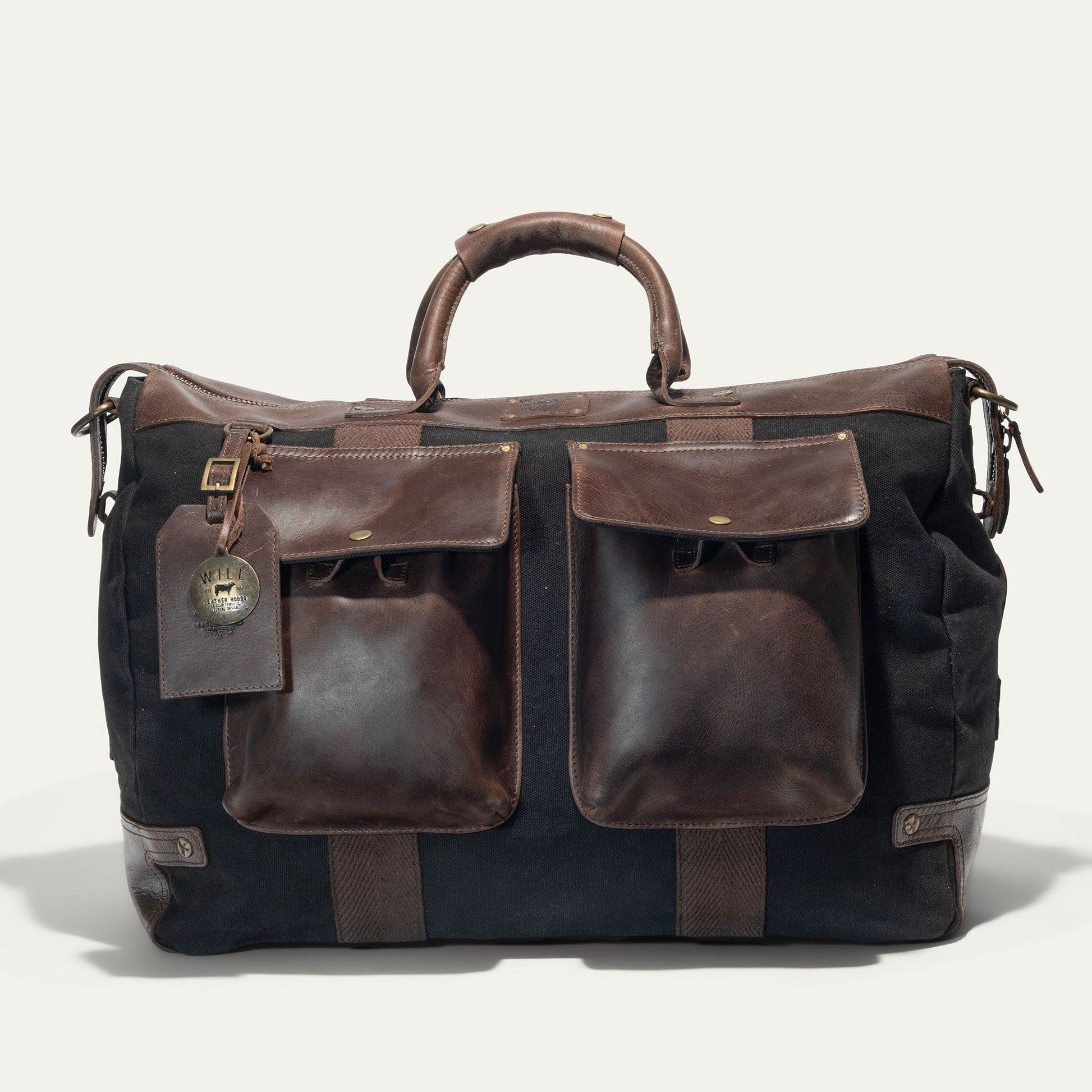 Canvas & Leather Travel Duffle by Will Leather Goods with brown leather trim and front pockets on Tampa Home & Garden Store