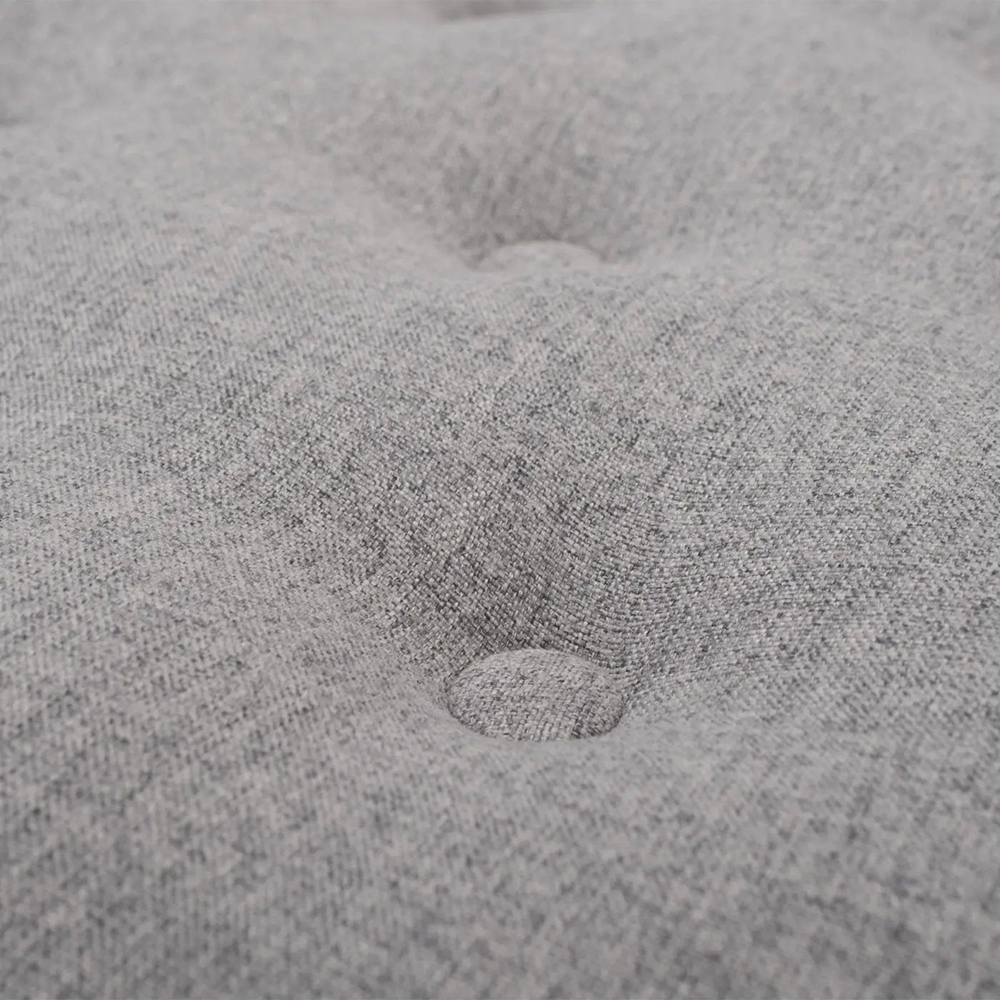 Yolanda round upholstered ottoman fabric close-up in grey with tufted button detailing on Tampa Home & Garden Store