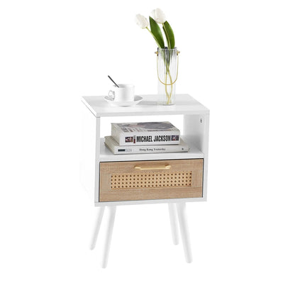 Rattan end table with drawer and solid wood legs, white finish; teacup on saucer and tall ribbed glass vase with white tulips on top on Tampa Home & Garden Store