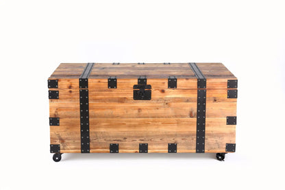 Trunk storage coffee table on wheels in natural wood with black metal straps by Unique Piece Furniture on Tampa Home & Garden Store