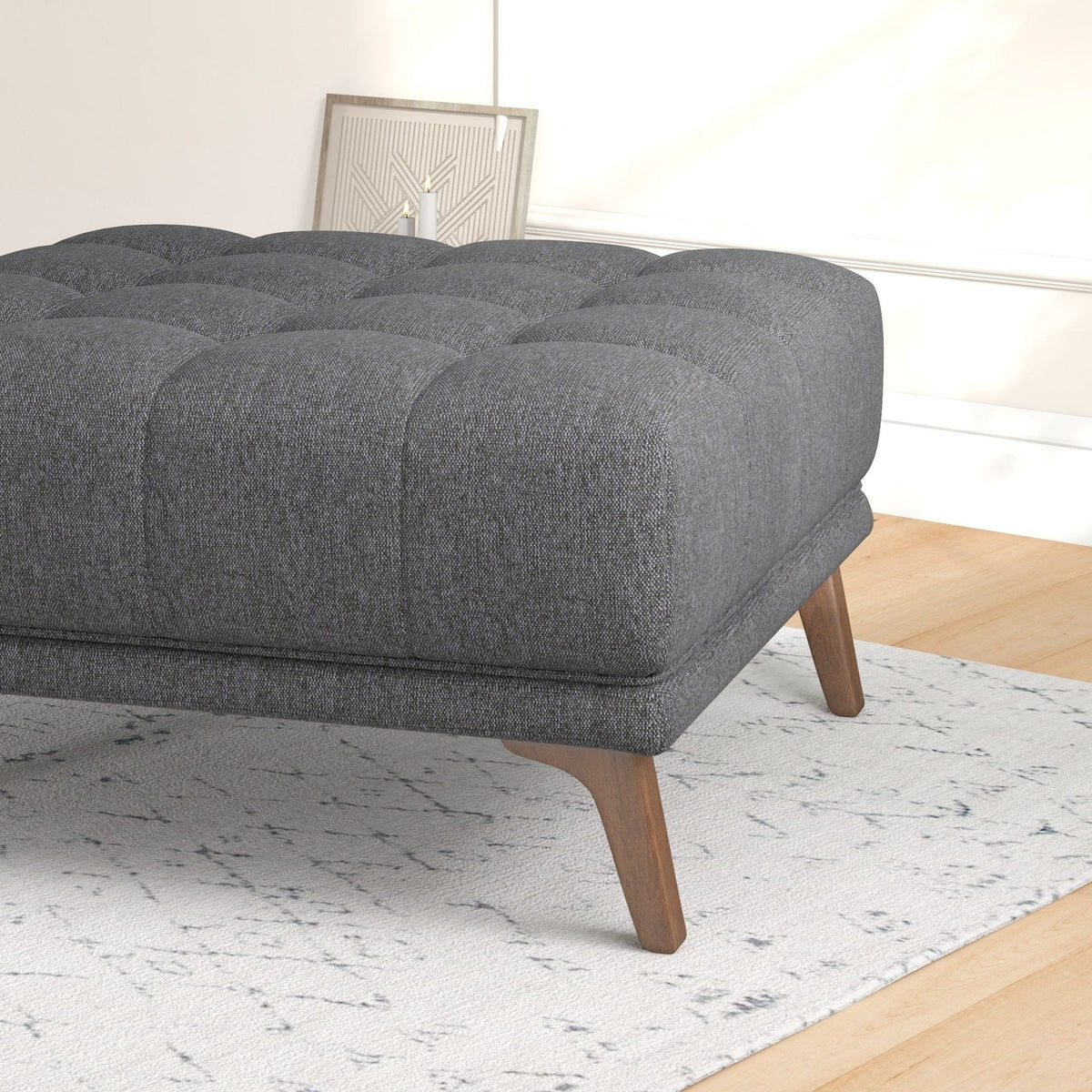 Addison Square upholstered ottoman in dark gray with tufted cushions and mid-century legs on Tampa Home & Garden Store