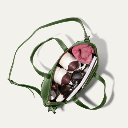 Simple Satchel in green leather with strap, open to show pink scarf and sunglasses inside on Tampa Home & Garden Store