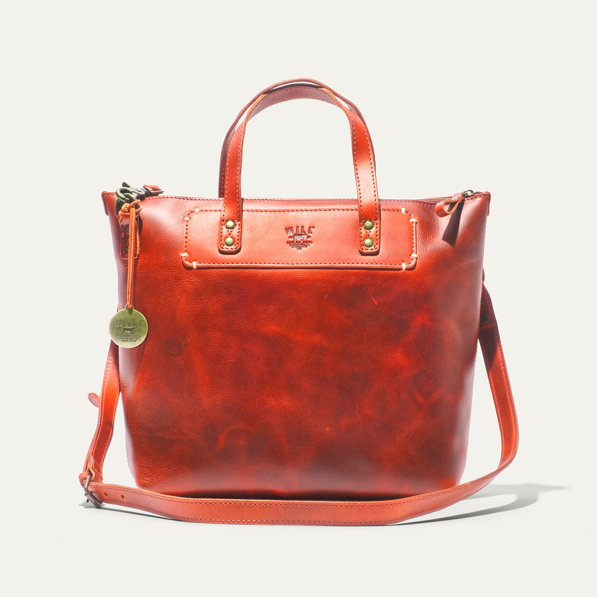 Simple Satchel by Will Leather Goods in orange leather with top handles and brass hardware on Tampa Home & Garden Store